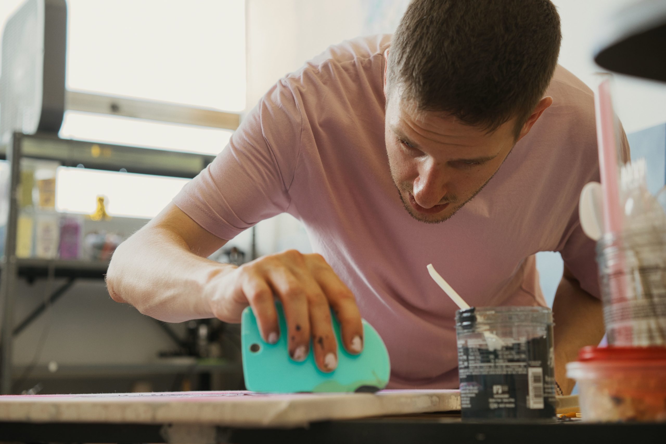 Male student screenprinting