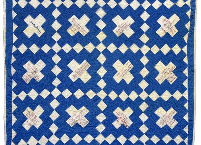 Blue and white quilt with X pattern