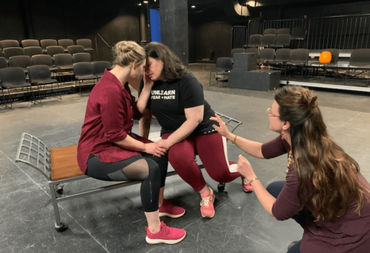 Alexis Black directs two women in a black box theatre through an intimate scene