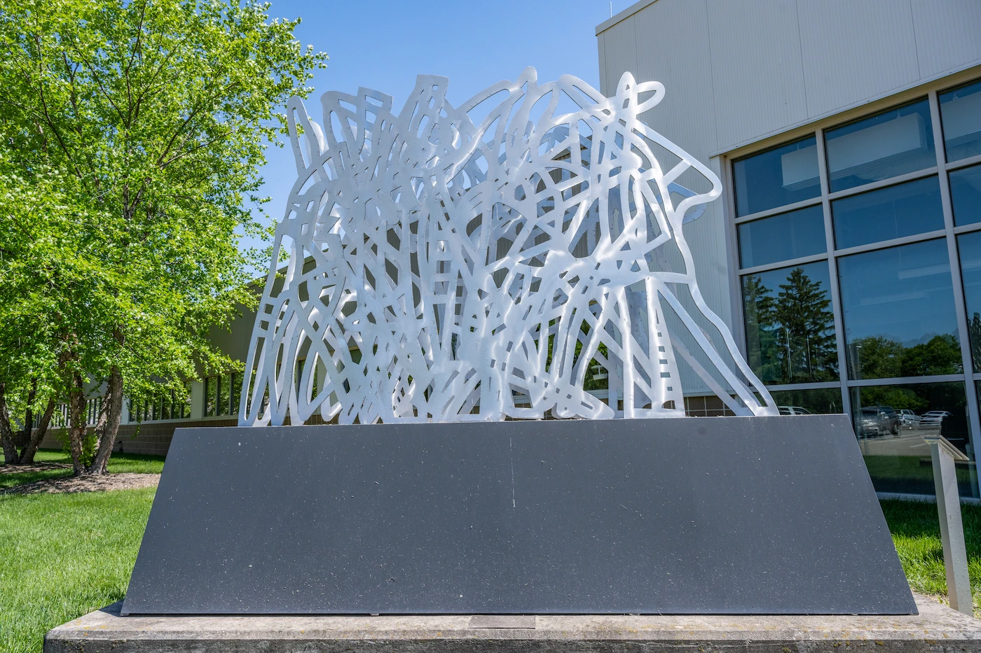 Silver sculpture featuring squiggles of powder-coated aluminum.